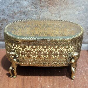 Vintage Gold Filigree Ormolu Beveled Glass Oval Jewelry Box Cherub Cupid Feet